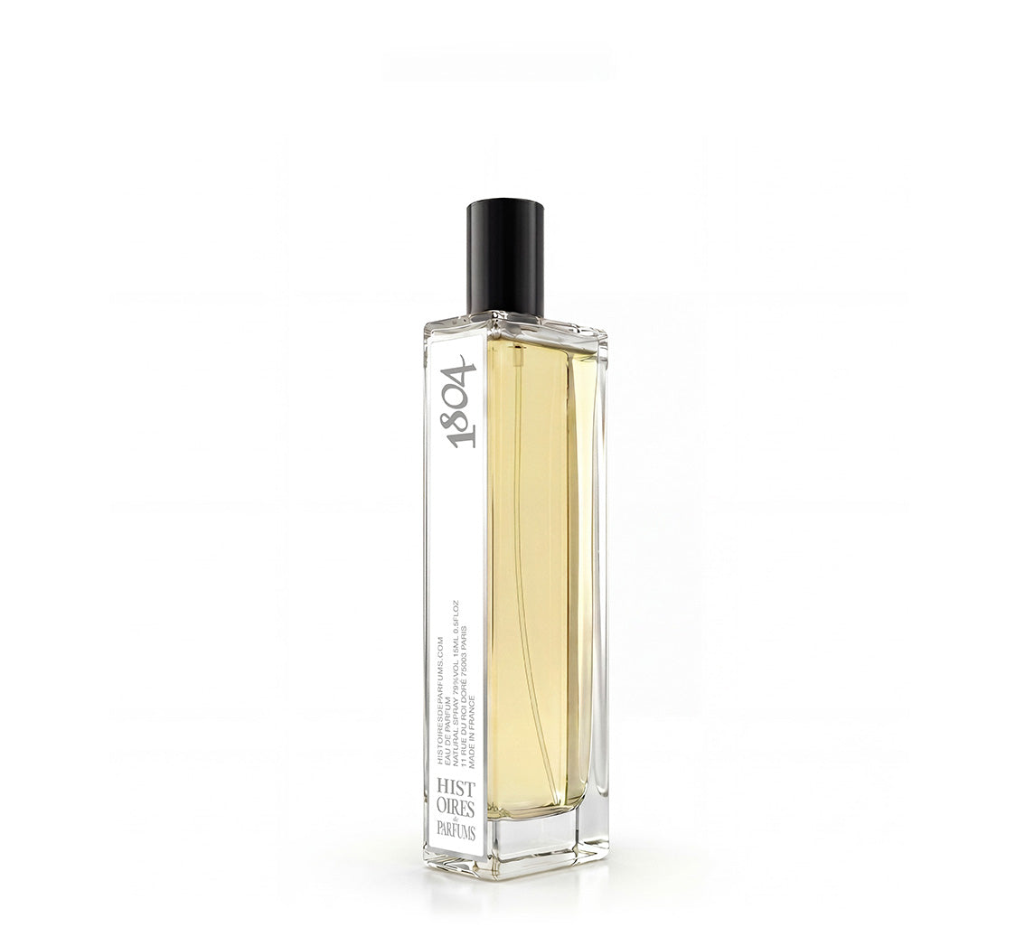 A 1804 glass perfume bottle with a black cap on a white background.