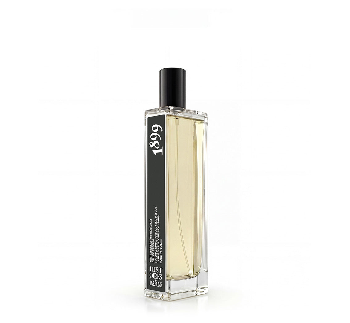A 1899 glass perfume bottle with a black cap on a white background.